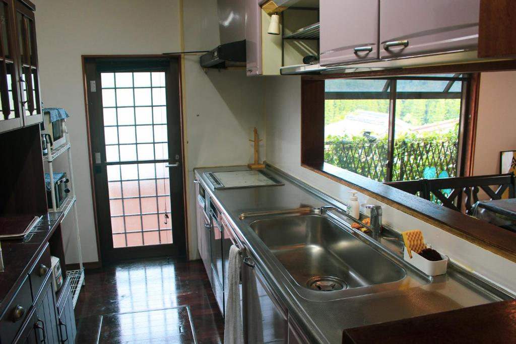 Kuchyň nebo kuchyňský kout v ubytování Guesthouse Yui