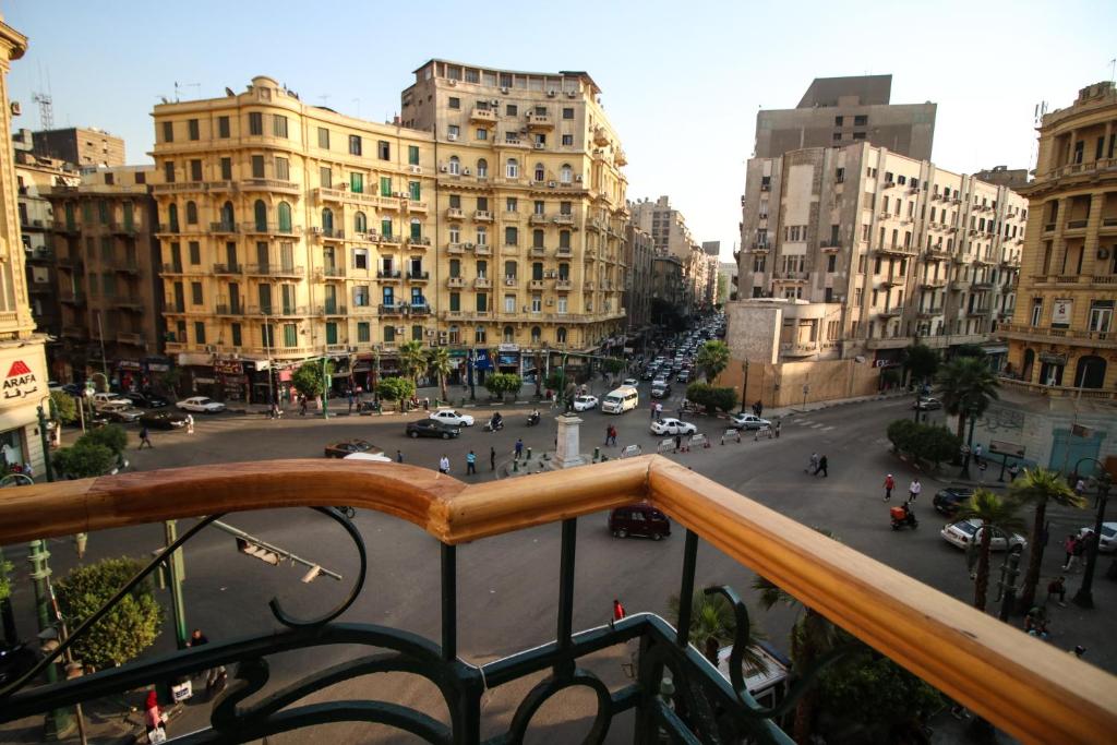 a view of a busy city street with buildings at Miramar Talaat Harb Square in Cairo
