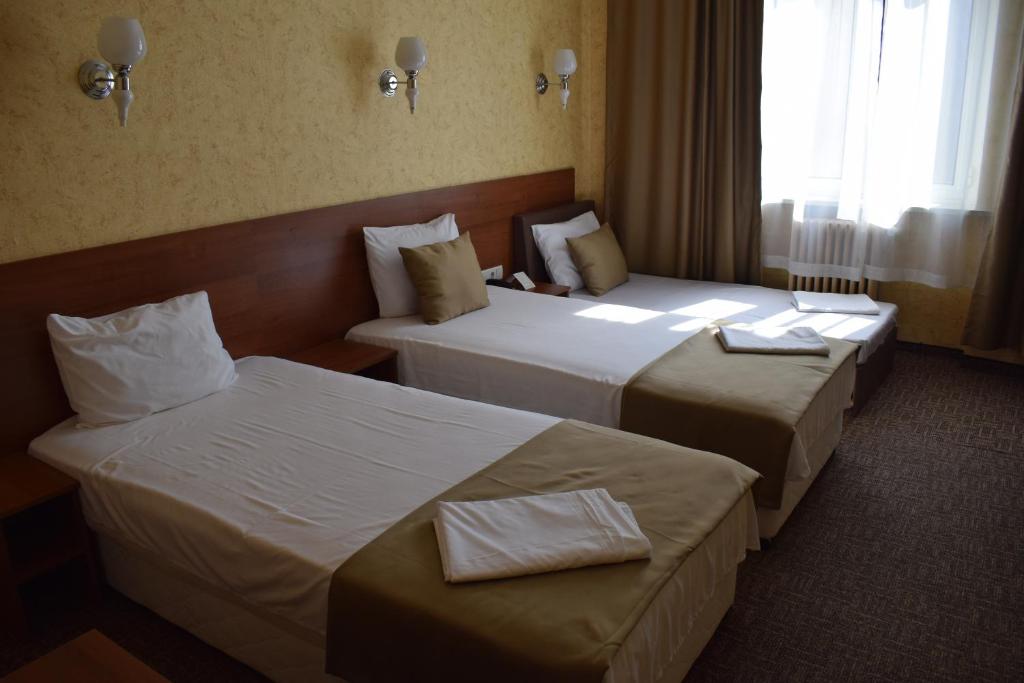 Postel nebo postele na pokoji v ubytování Slavyanska Beseda Hotel
