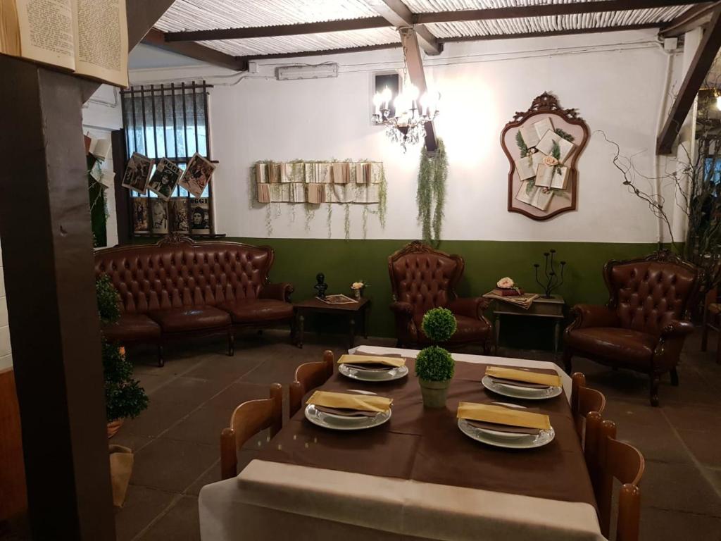 a dining room with a table and chairs at Hotel Monte Sirai in Carbonia