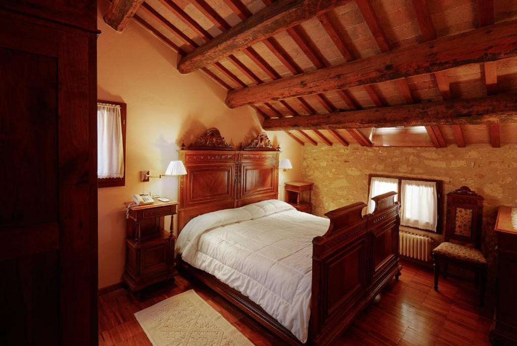 Łóżko lub łóżka w pokoju w obiekcie Agriturismo Le Vescovane
