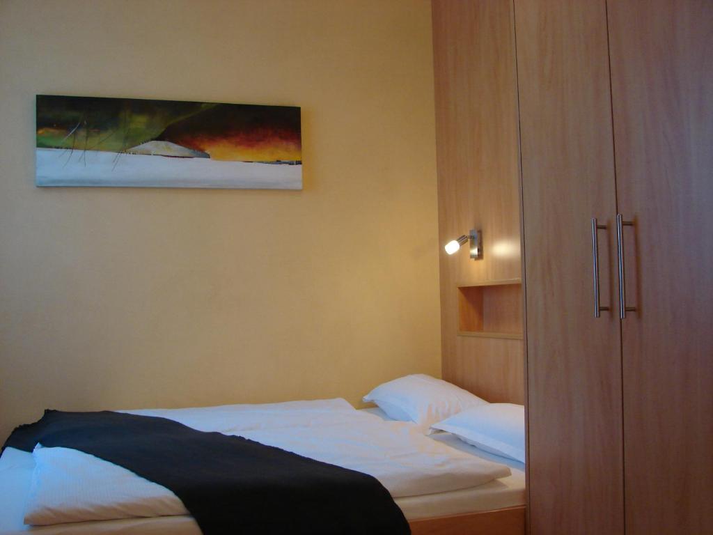 Postel nebo postele na pokoji v ubytování Rotenberg PT Hotel