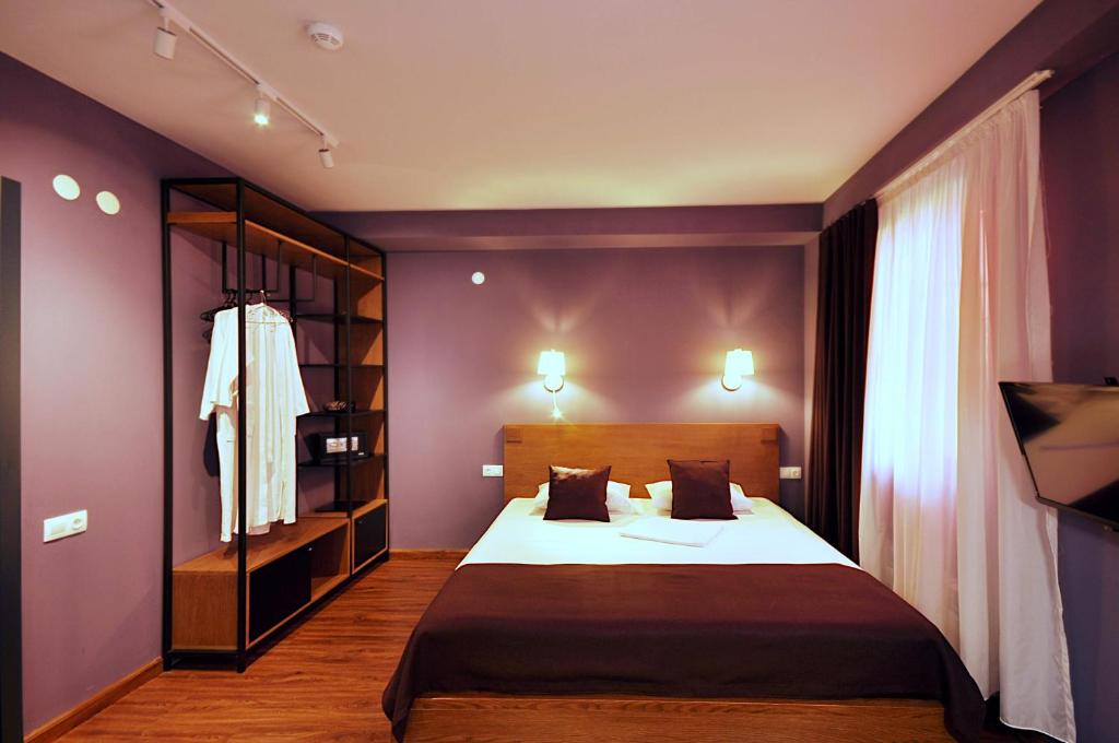Postel nebo postele na pokoji v ubytování Elle Boutique Hotel