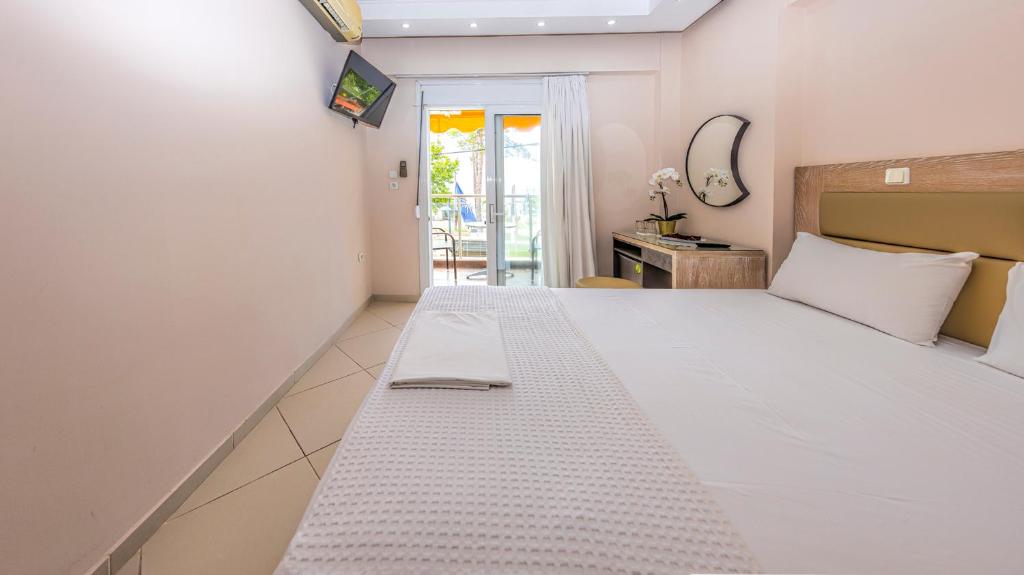 Postel nebo postele na pokoji v ubytování Le Monde SeaView Suites