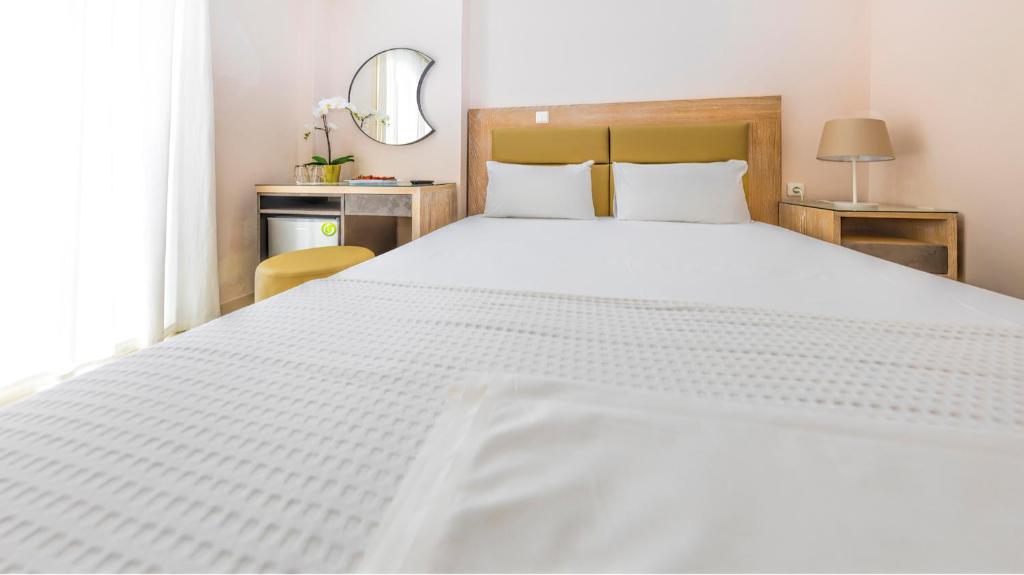 Postel nebo postele na pokoji v ubytování Le Monde SeaView Suites