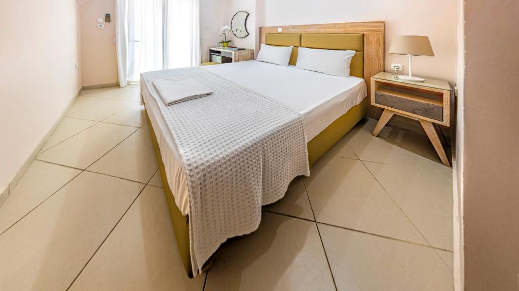 Postel nebo postele na pokoji v ubytování Le Monde SeaView Suites