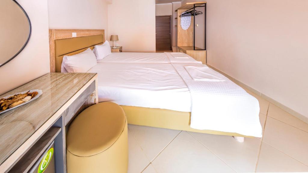 Postel nebo postele na pokoji v ubytování Le Monde SeaView Suites