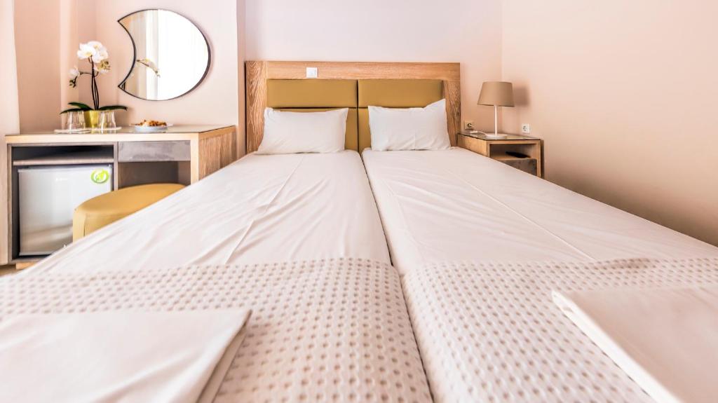 Postel nebo postele na pokoji v ubytování Le Monde SeaView Suites
