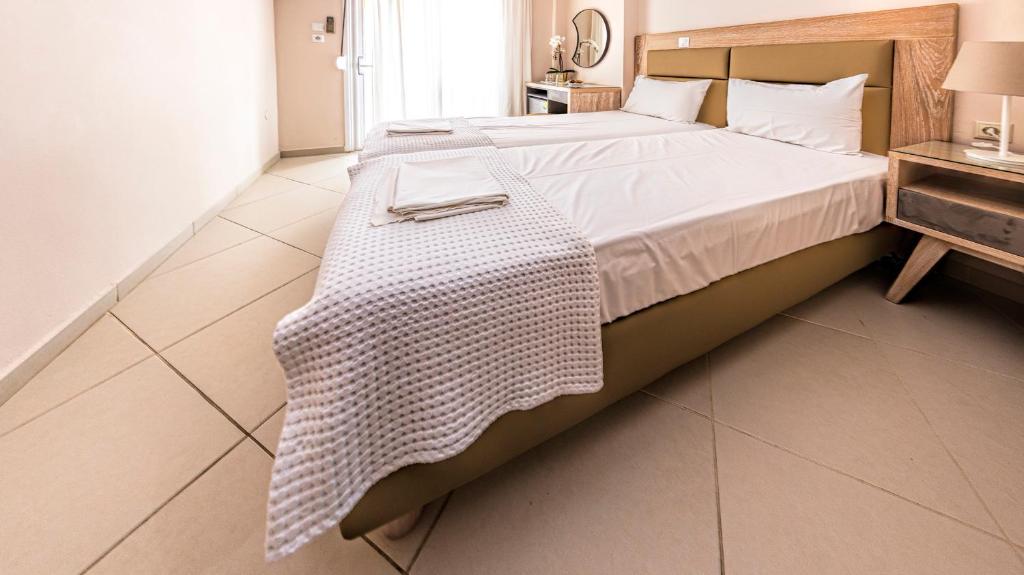 Postel nebo postele na pokoji v ubytování Le Monde SeaView Suites