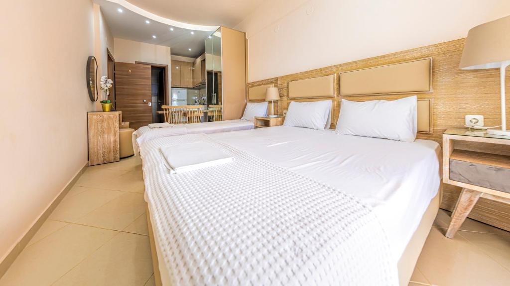 Postel nebo postele na pokoji v ubytování Le Monde SeaView Suites