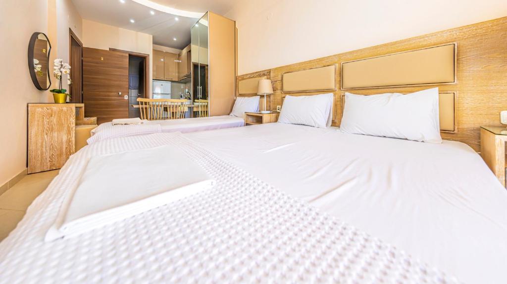 Postel nebo postele na pokoji v ubytování Le Monde SeaView Suites