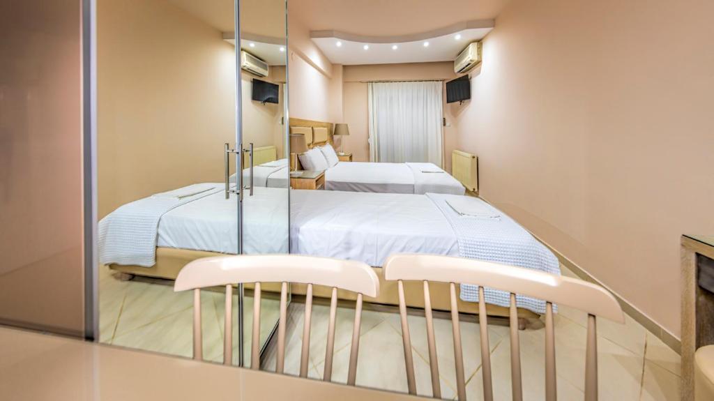Postel nebo postele na pokoji v ubytování Le Monde SeaView Suites