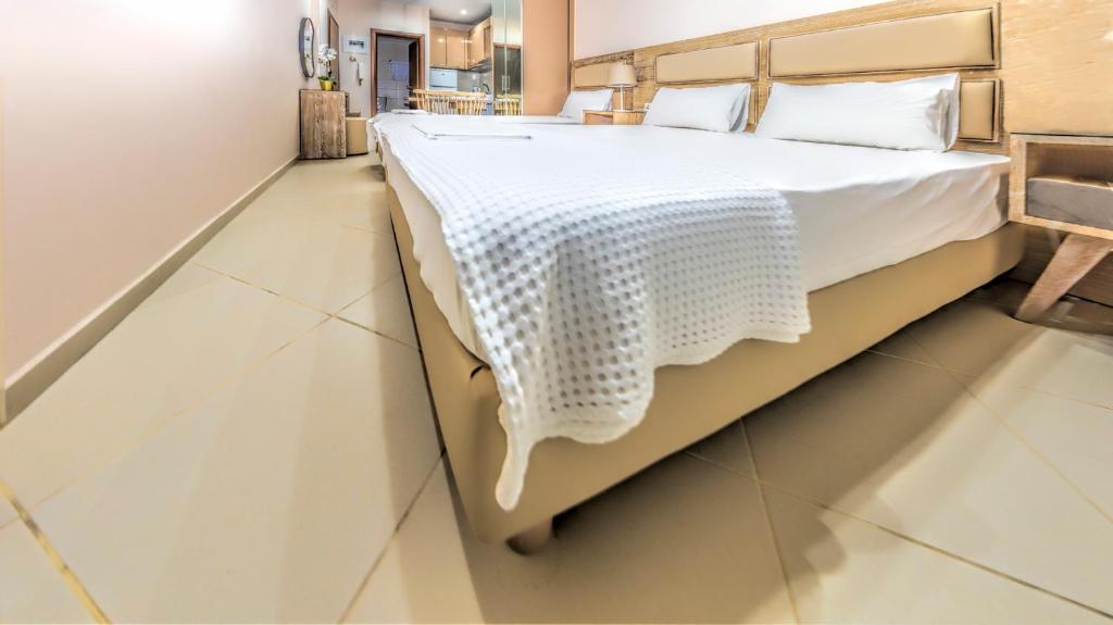 Postel nebo postele na pokoji v ubytování Le Monde SeaView Suites