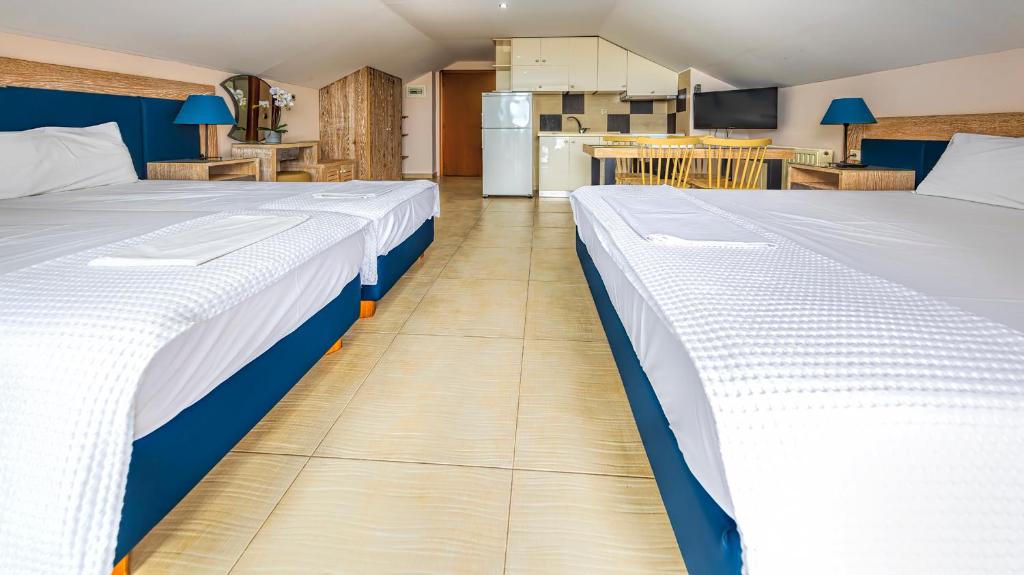 Postel nebo postele na pokoji v ubytování Le Monde SeaView Suites