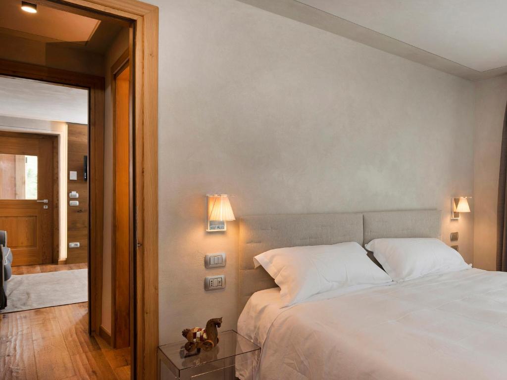 Postel nebo postele na pokoji v ubytování 3 Chalets Aparthotel
