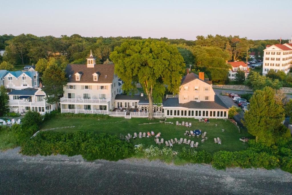an aerial view of a house with a group of people on a lawn at The Breakwater Inn & Spa in Kennebunkport