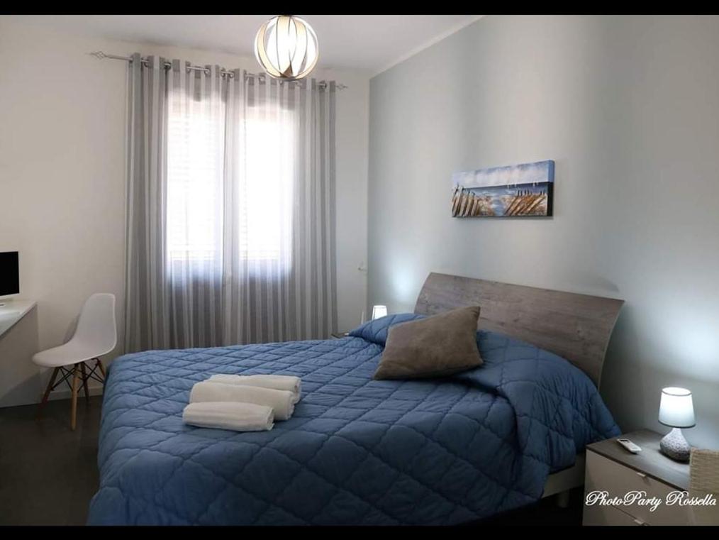 Łóżko lub łóżka w pokoju w obiekcie B&B Al Porticciolo