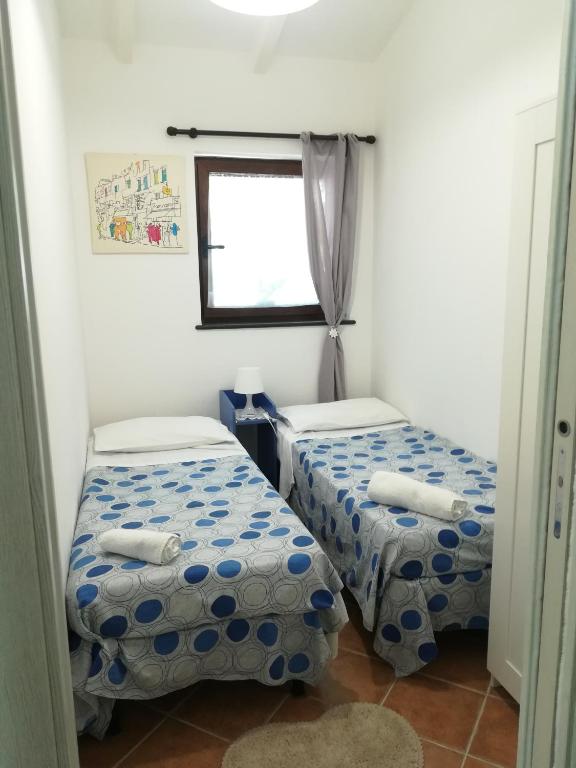 Postel nebo postele na pokoji v ubytování Villino L'Aranceto Sorrentino