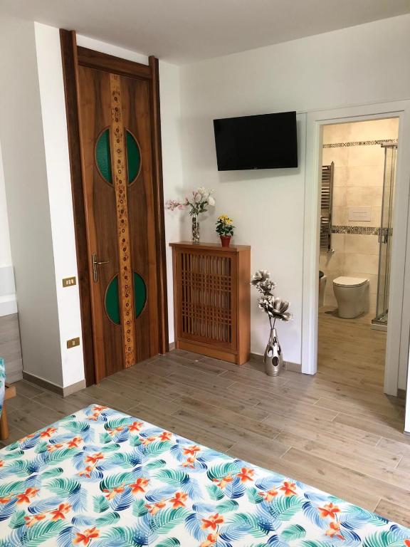 Posteľ alebo postele v izbe v ubytovaní B&B IL CAVALIERE