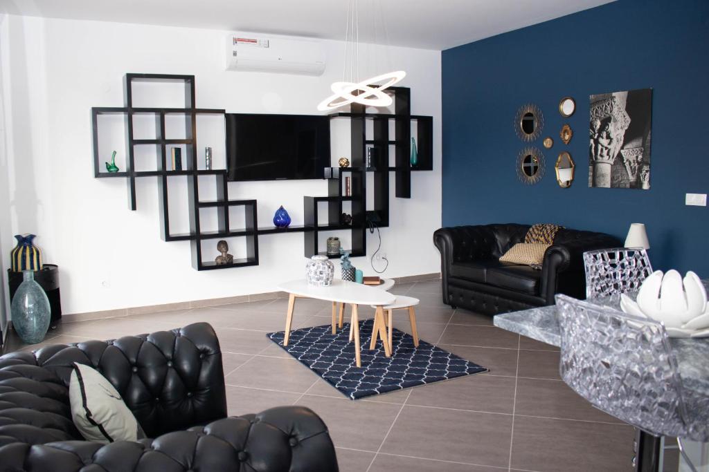 TV a/nebo společenská místnost v ubytování Aparthotel Palace