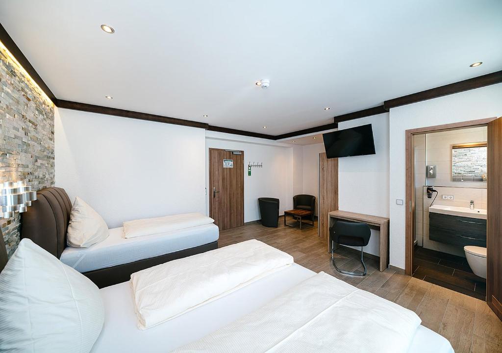 Postel nebo postele na pokoji v ubytování Central City Hotel