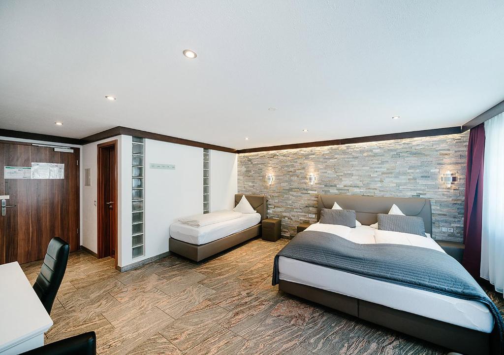 Postel nebo postele na pokoji v ubytování Central City Hotel