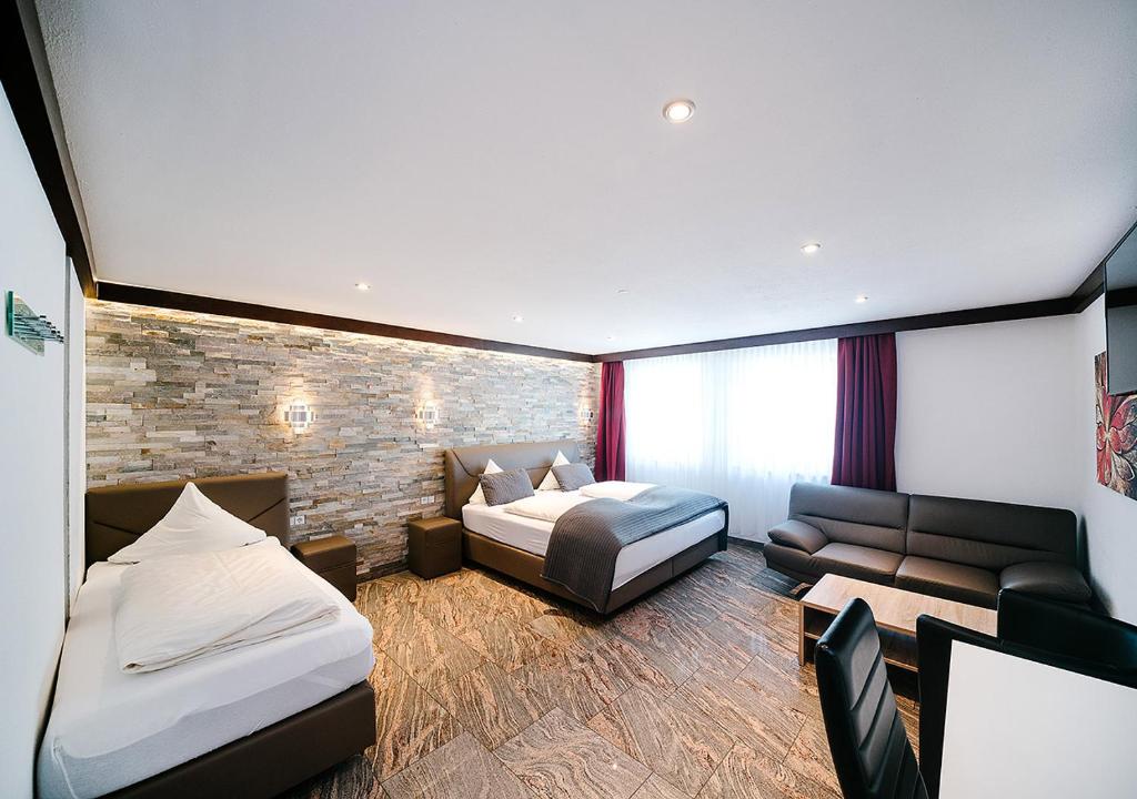 Postel nebo postele na pokoji v ubytování Central City Hotel