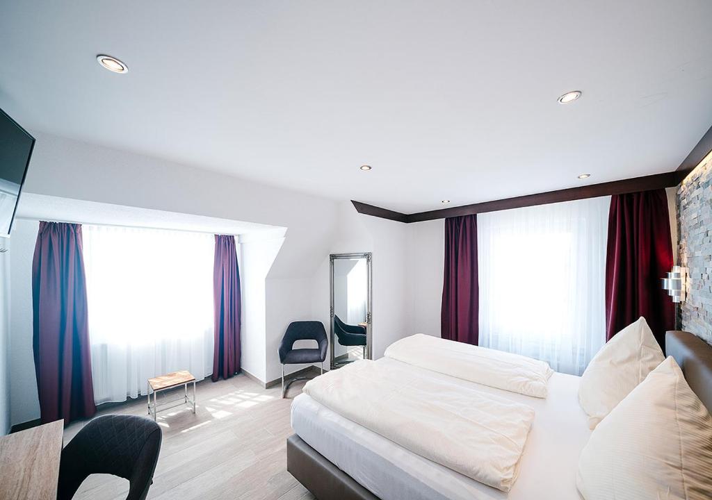 Postel nebo postele na pokoji v ubytování Central City Hotel
