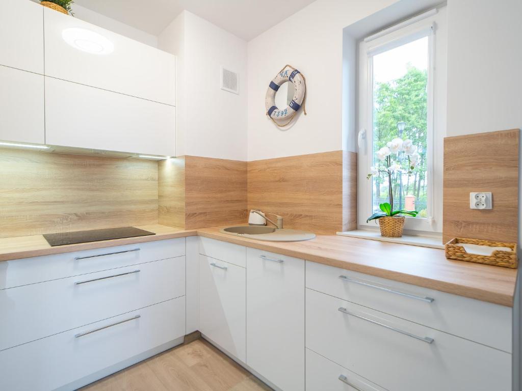 Kuchyňa alebo kuchynka v ubytovaní Apartament Happy Time SPA - Kołobrzeg