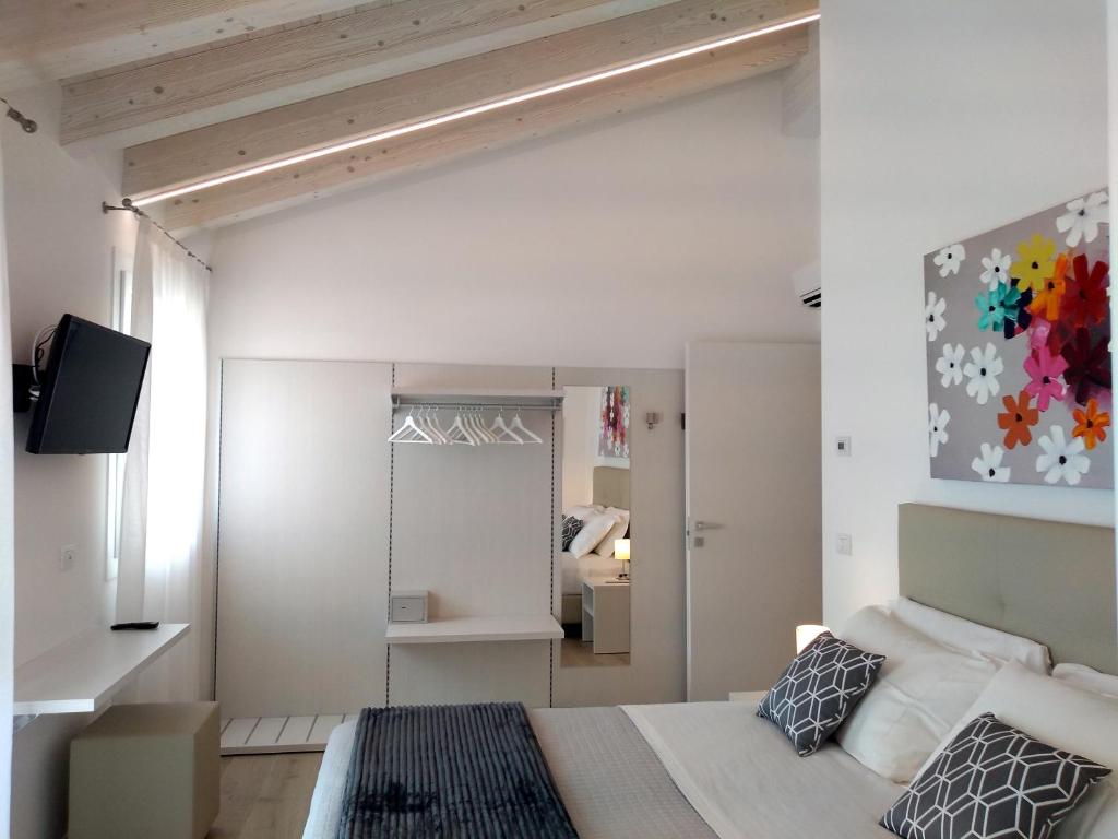 Postel nebo postele na pokoji v ubytování Le Mandragole B&B