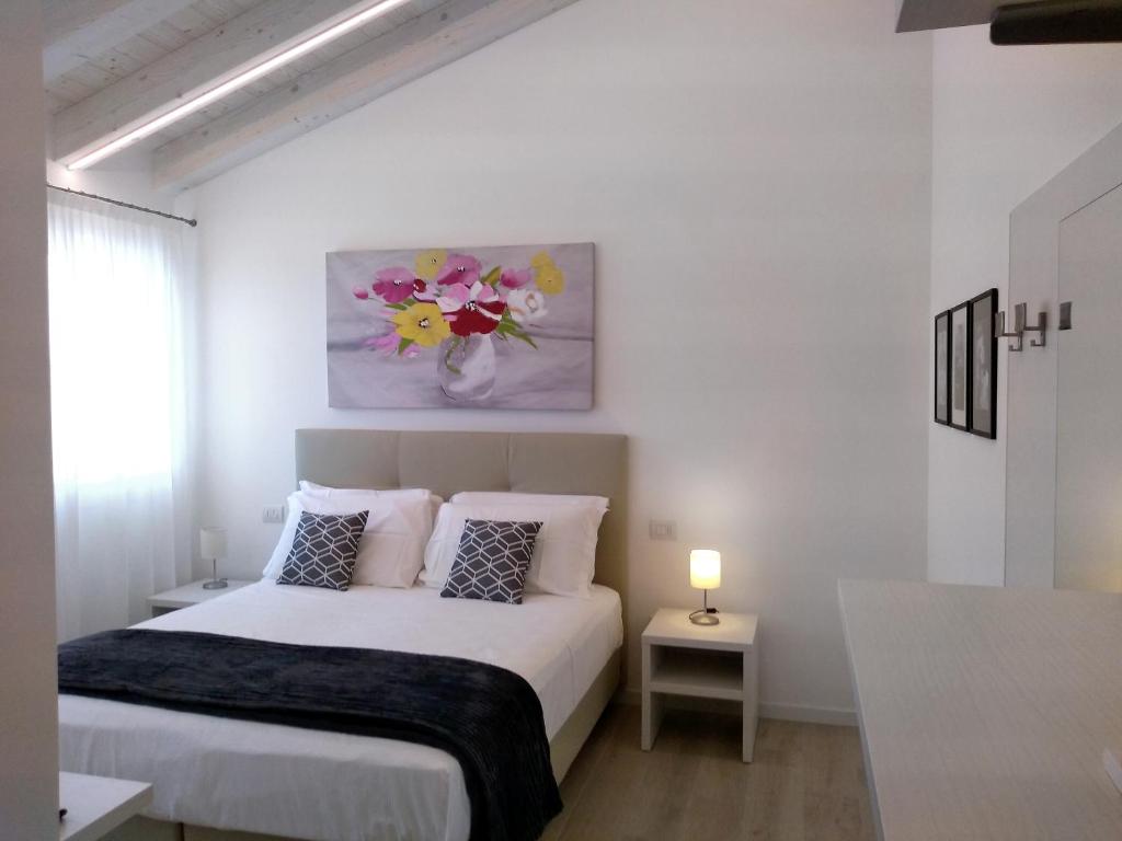 Postel nebo postele na pokoji v ubytování Le Mandragole B&B