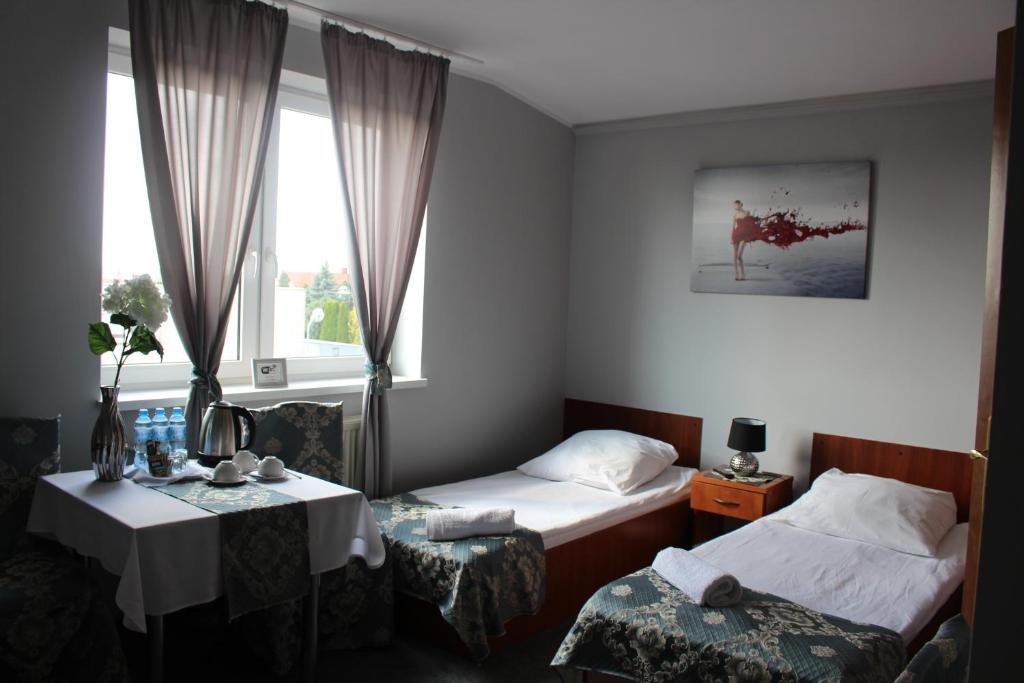 Posteľ alebo postele v izbe v ubytovaní Restauracja Hotel Kassandra