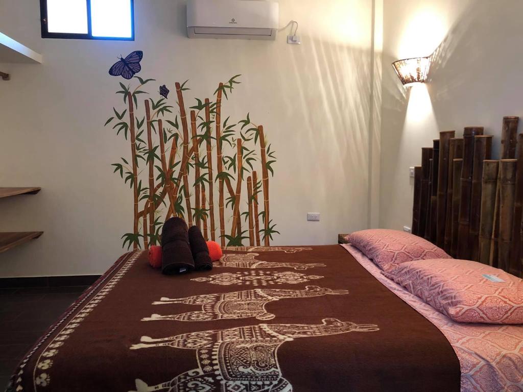 Postel nebo postele na pokoji v ubytování CASITA MADAME