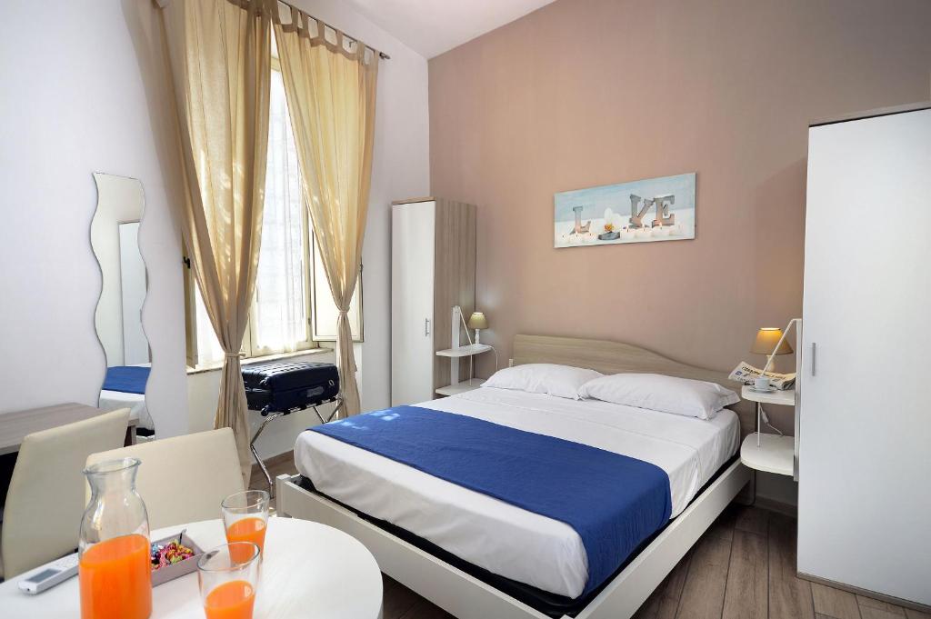 Posteľ alebo postele v izbe v ubytovaní B&B Funikuli Funikula