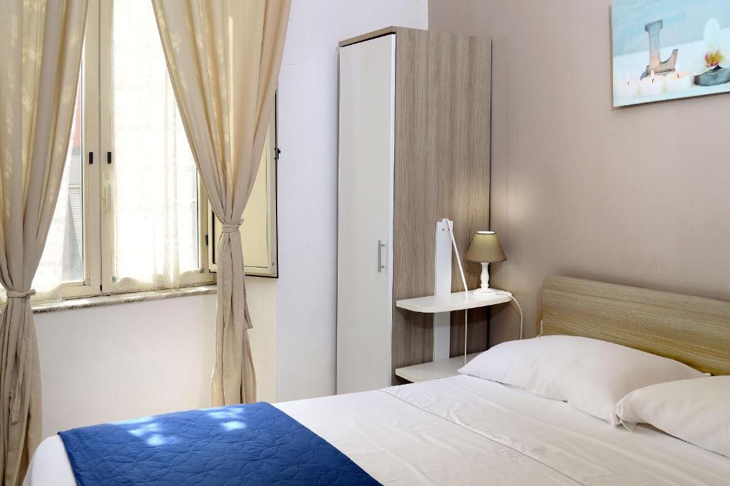 Posteľ alebo postele v izbe v ubytovaní B&B Funikuli Funikula