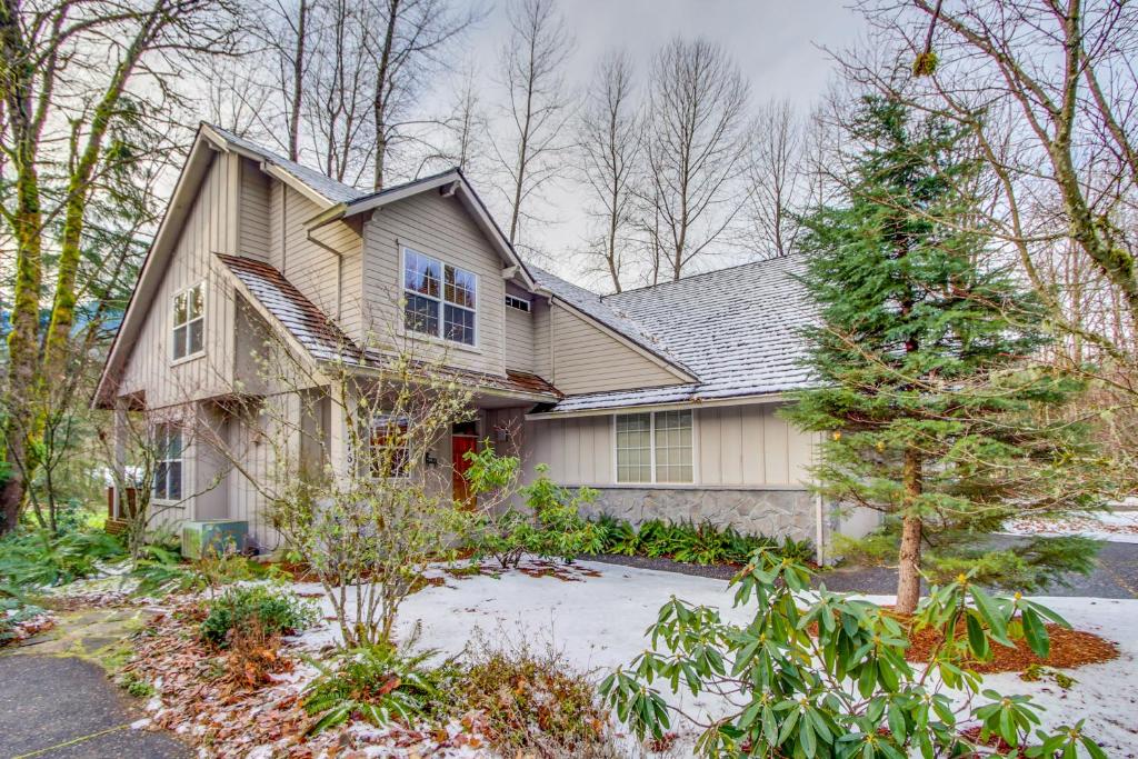 a house with a christmas tree in the yard at Welches Fairway Retreat in Welches