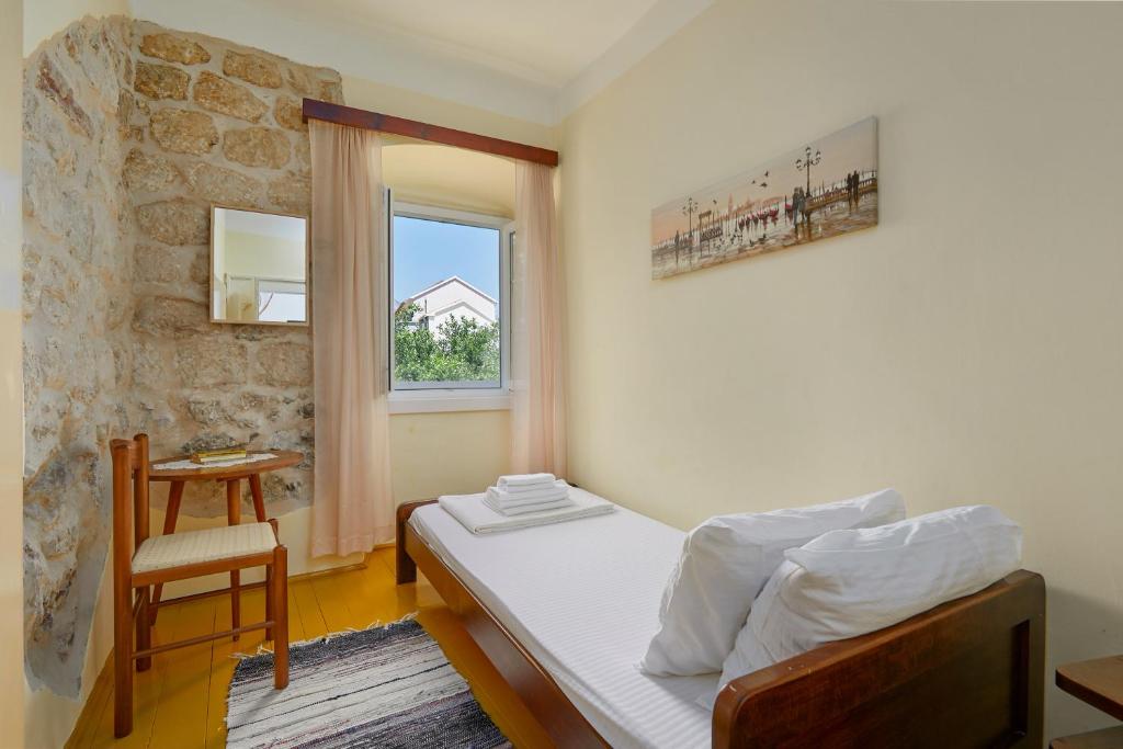 Postel nebo postele na pokoji v ubytování Mediterranean Holiday House & Apartments