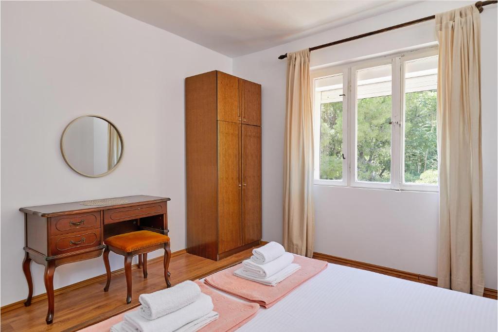 Postel nebo postele na pokoji v ubytování Mediterranean Holiday House & Apartments