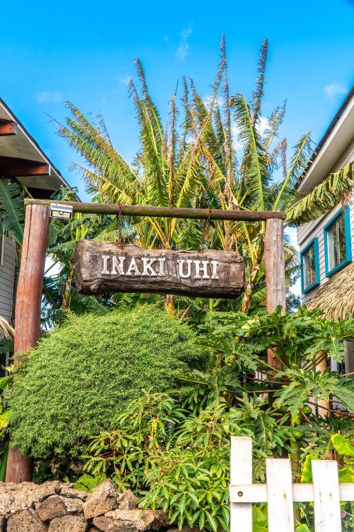 a sign that readsanking out in front of a house at Inaki Uhi Hotel in Hanga Roa