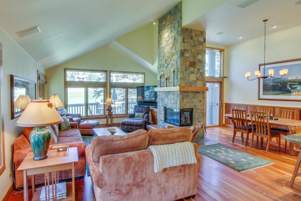 a living room with a couch and a fireplace at Legends - Simply Perfect Elkhorn Retreat in Sun Valley