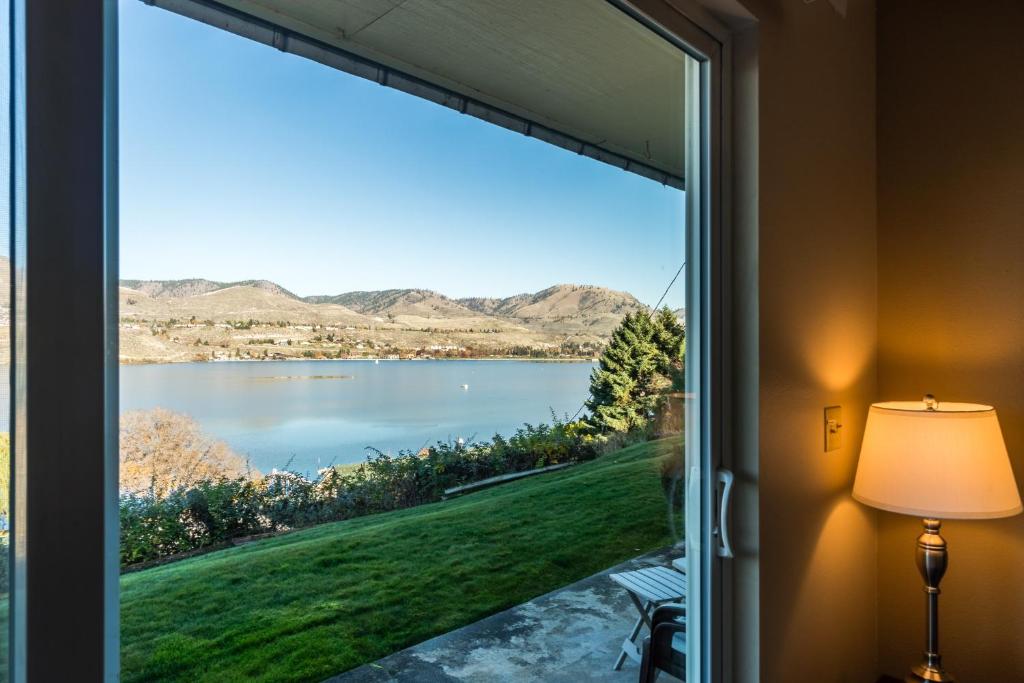 a window in a room with a view of a lake at Perfect View in Chelan