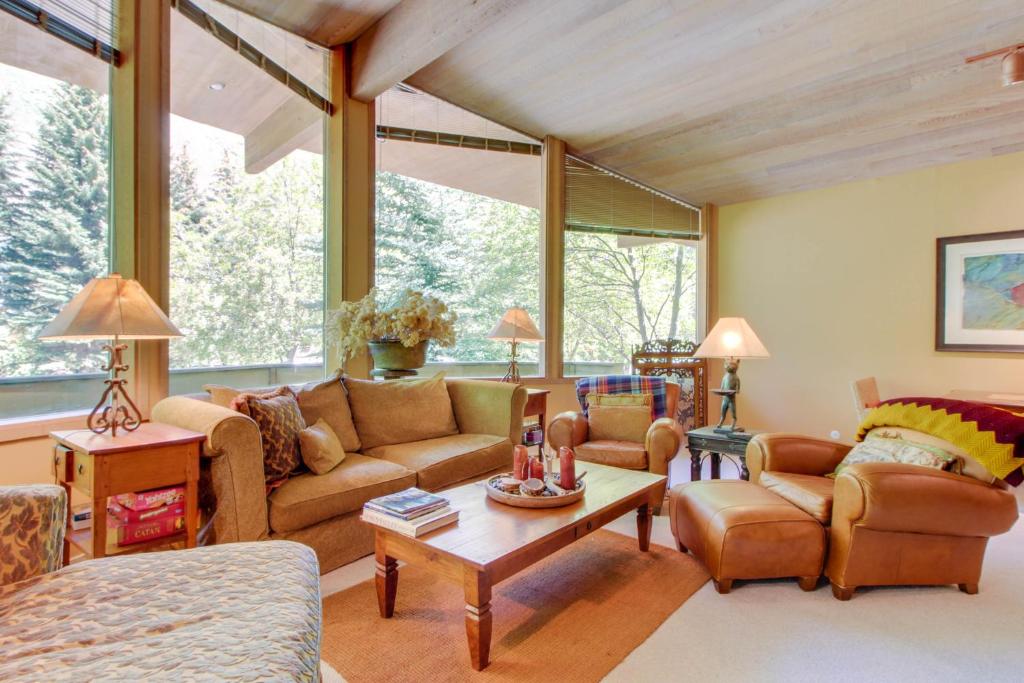 a living room with a couch and a table at Sunny Side Lodge in Ketchum