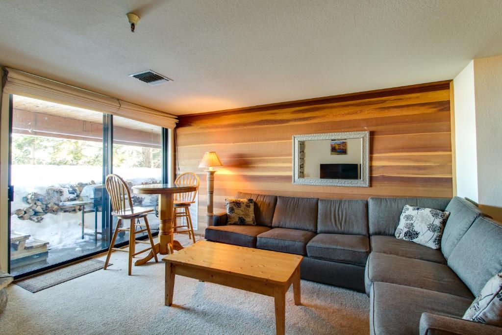 a living room with a couch and a table at The Bridges 102 in Mammoth Lakes
