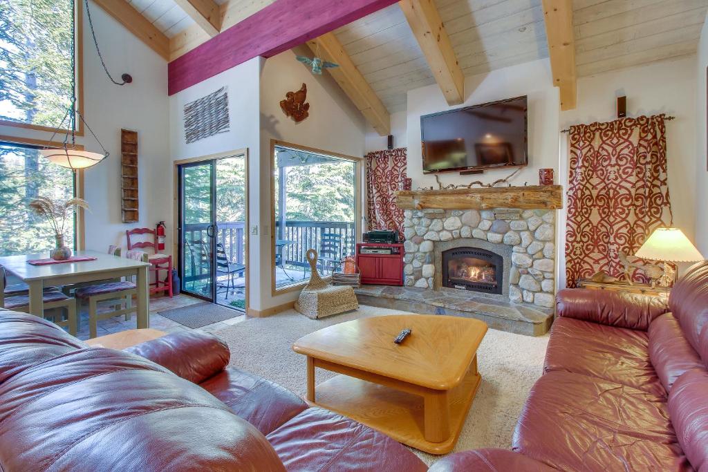 a living room with a couch and a fireplace at Val D'Isere 45 in Mammoth Lakes