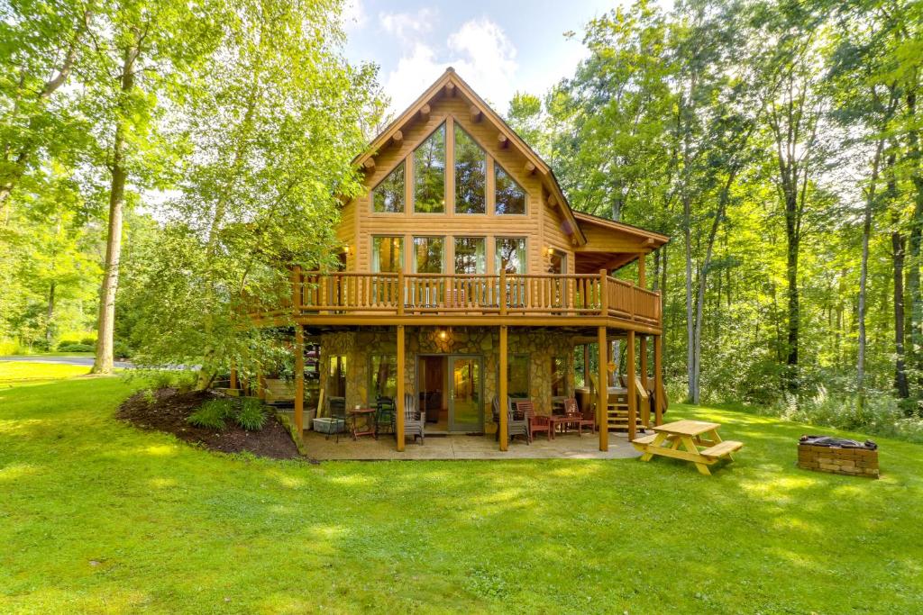 a large wooden house in the middle of a yard at 5 Little Acorns in McHenry