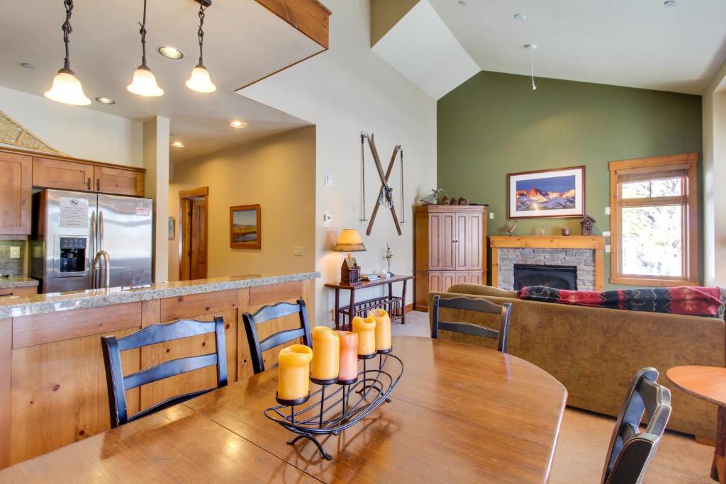 a kitchen and living room with a table and a couch at Lodestar Cabins in Mammoth Lakes