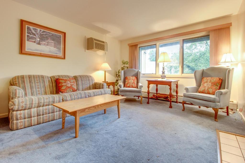 a living room with a couch and two chairs and a table at Mountainside Resort: K105 in Stowe