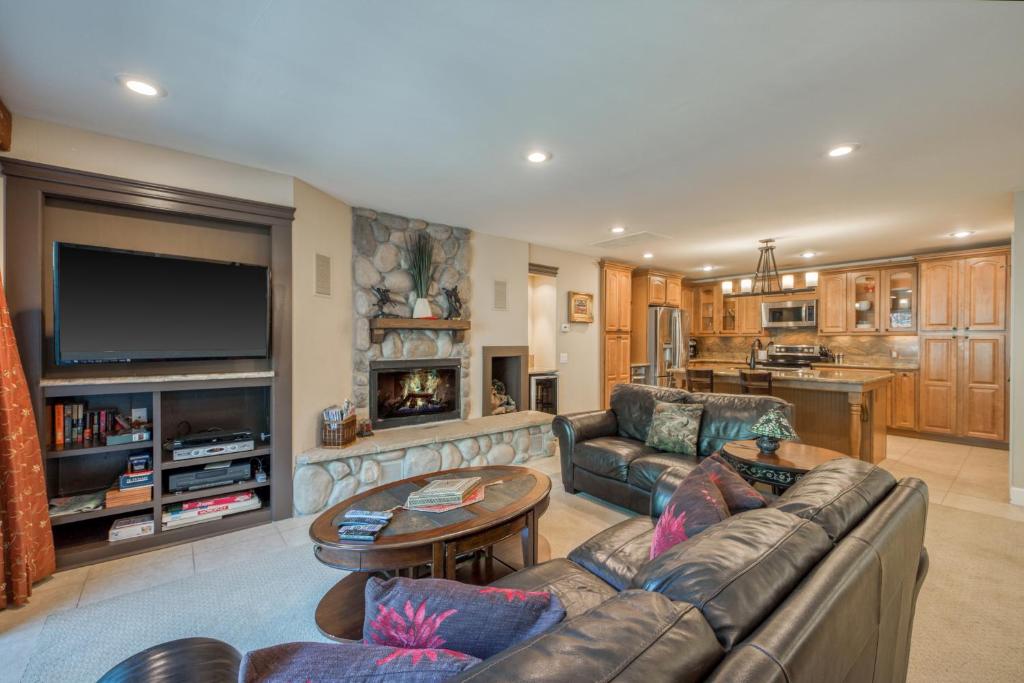 a living room with a couch and a table at Cedars West in Incline Village