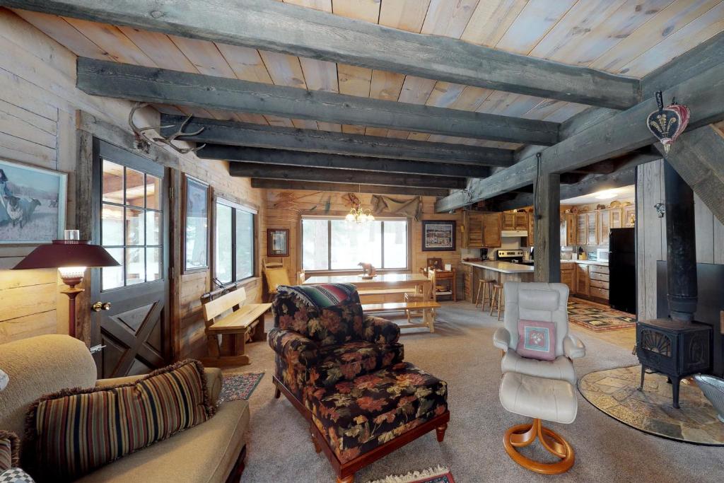 a living room with a couch and a table at Totorica Cabin in McCall