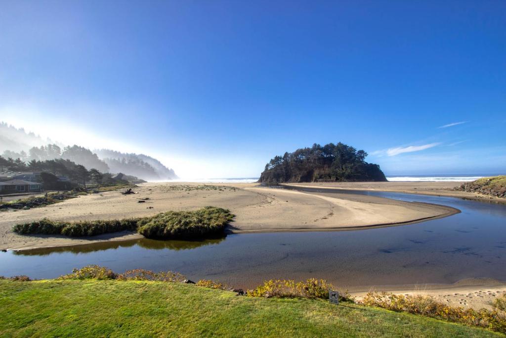 a view of a beach with a body of water at Neskowin Resort Unit #203 in Neskowin